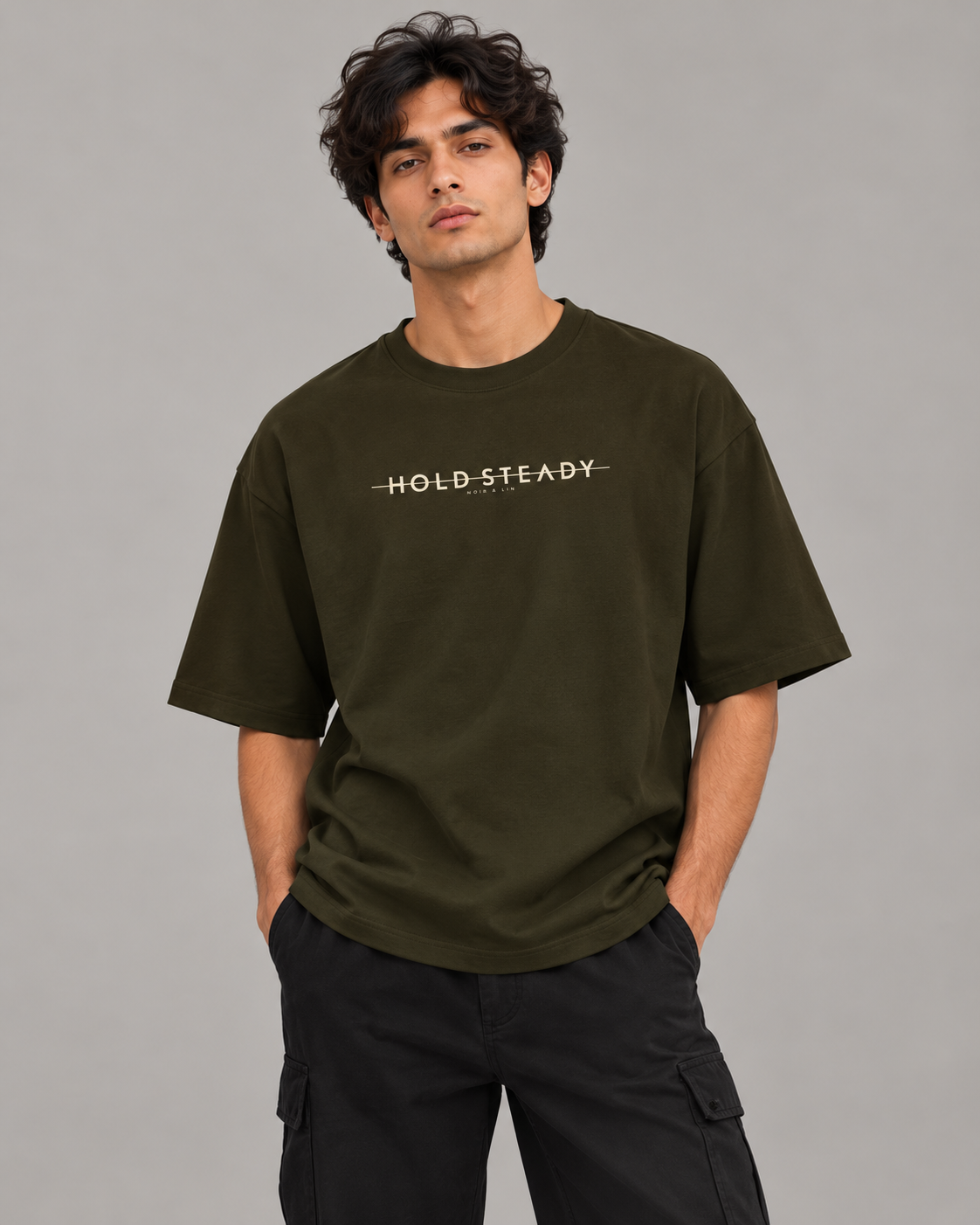 Noir & Lin HOLD STEADY oversized graphic tee in Olive Green, editorial model photo (AI-generated model image)