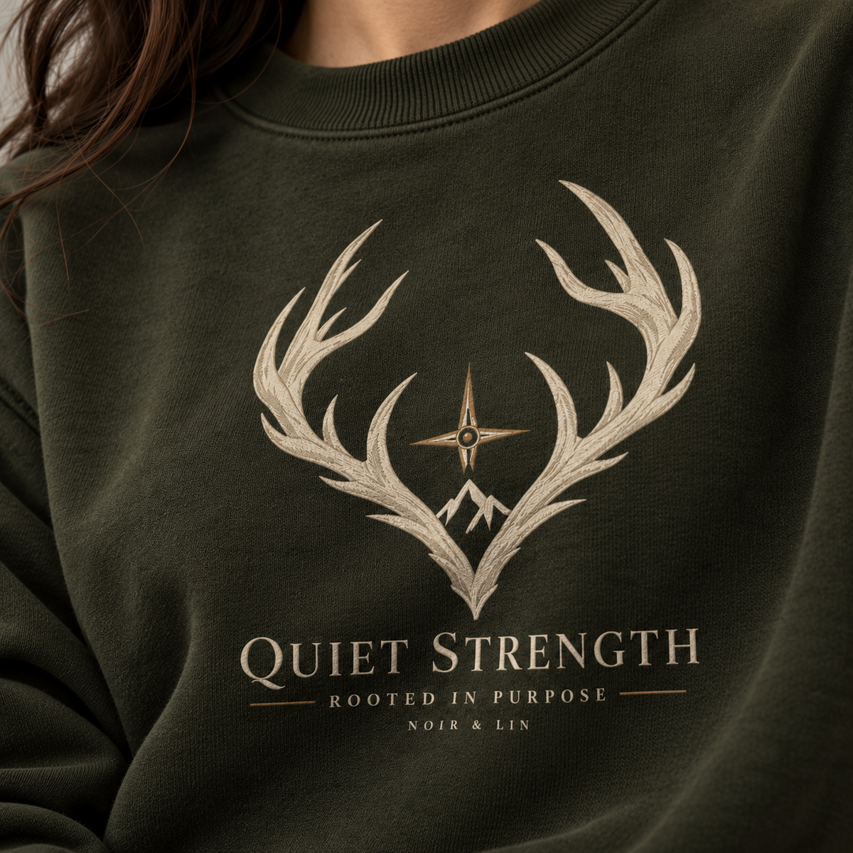 Noir & Lin QUIET STRENGTH crewneck sweatshirt in Olive Green with antler graphic (AI-generated image)
