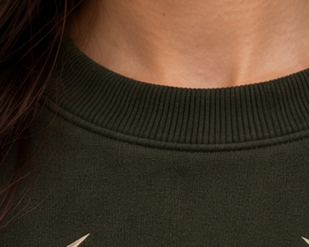 Noir & Lin QUIET STRENGTH sweatshirt in Olive Green, ribbed collar close-up